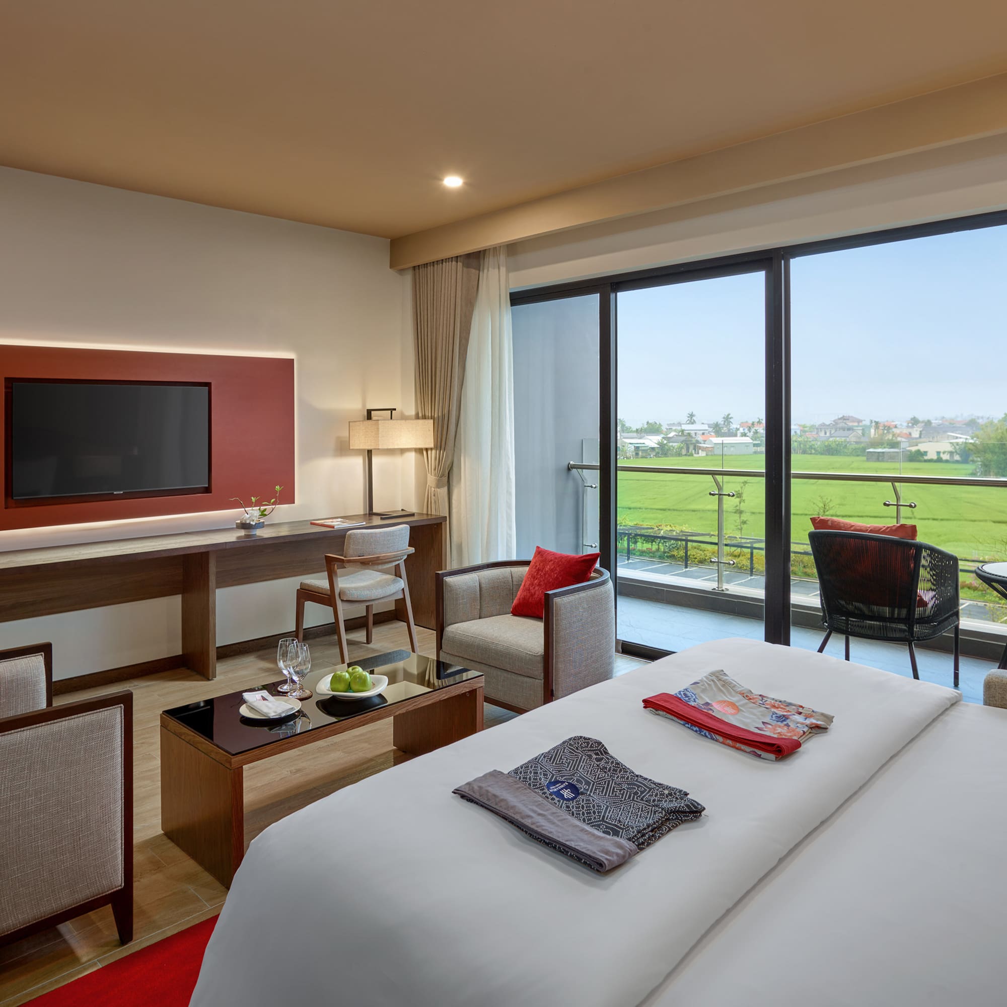 a room with a television and a golf course view