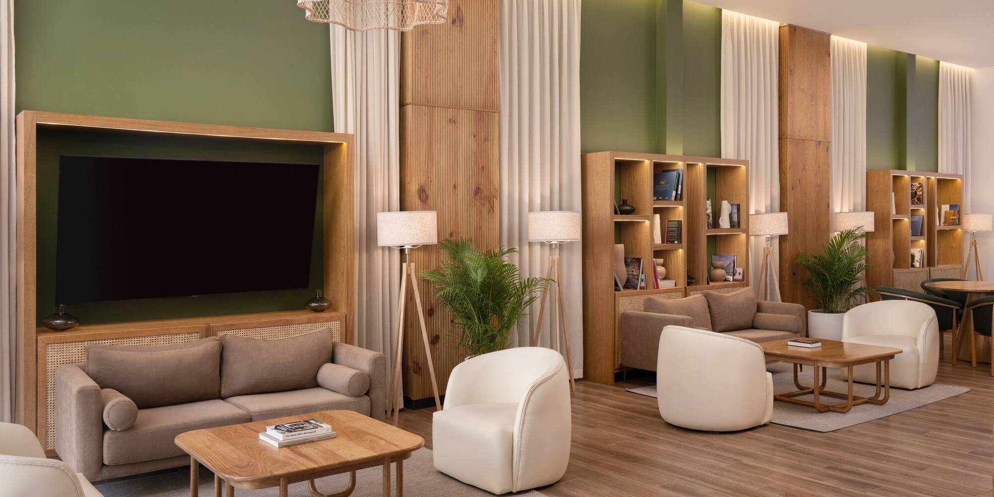 a room with a tv and couches