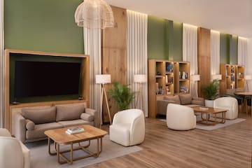 a room with a tv and couches