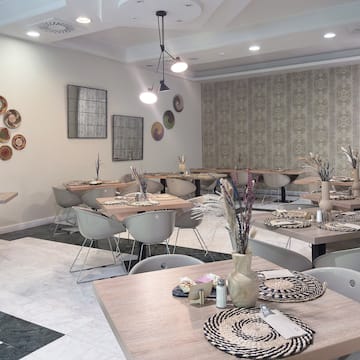 a room with tables and chairs