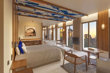 a bedroom with a bed and a tub