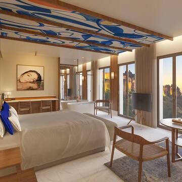 a bedroom with a bed and a tub