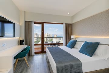 a bedroom with a bed and a desk