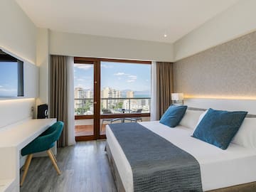 a bedroom with a bed and a desk