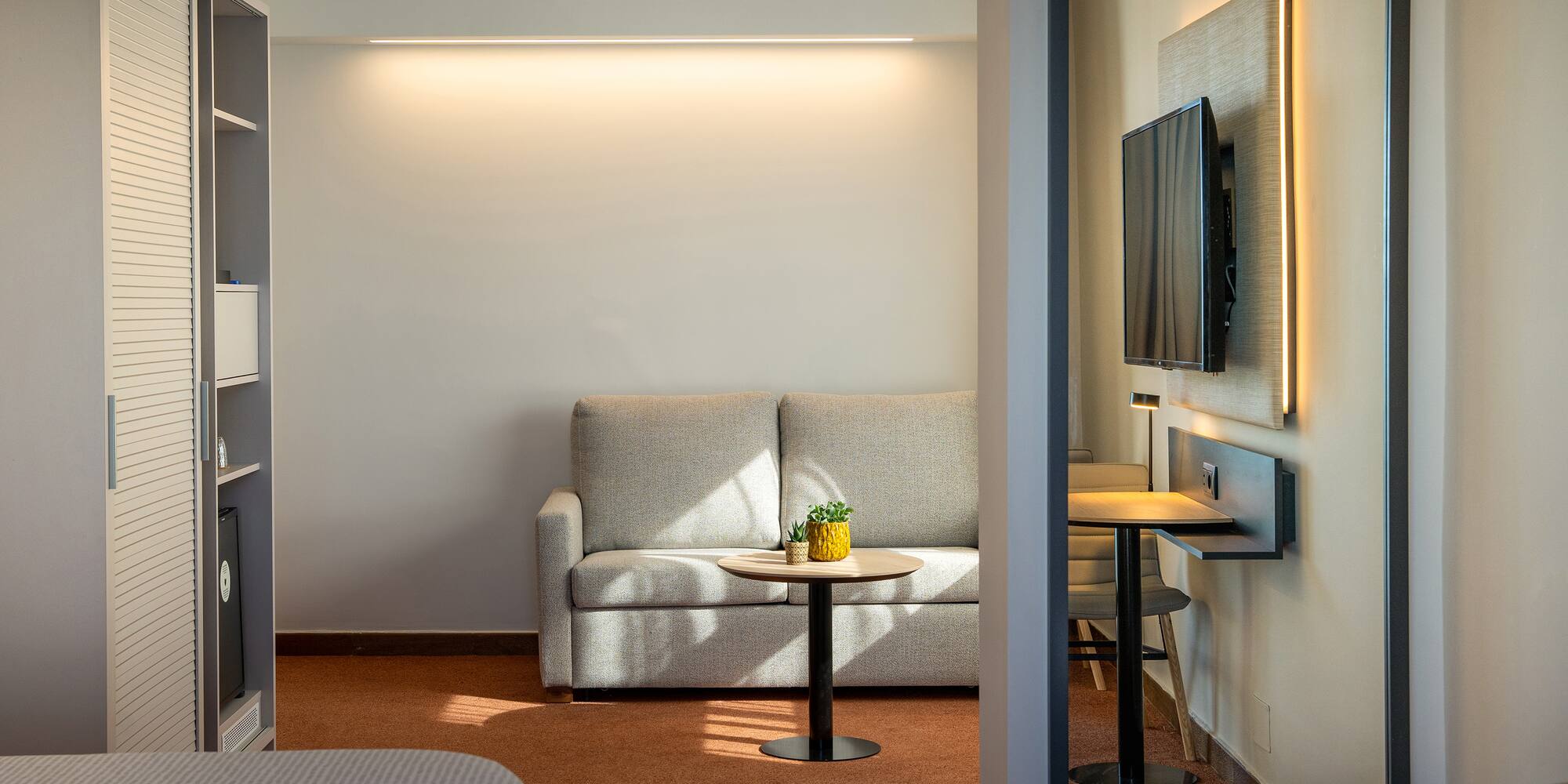 a room with a couch and tv