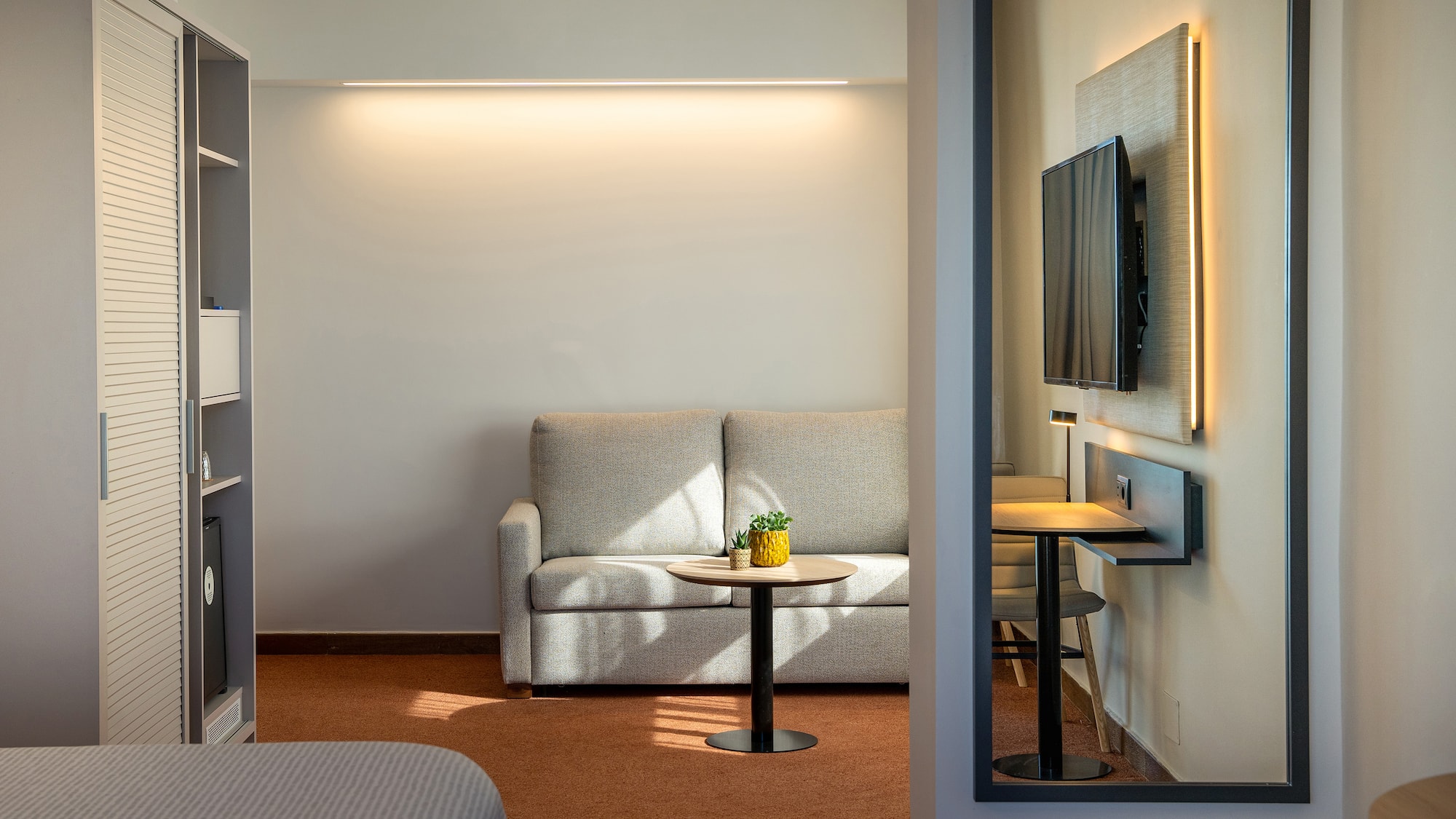 a room with a couch and tv