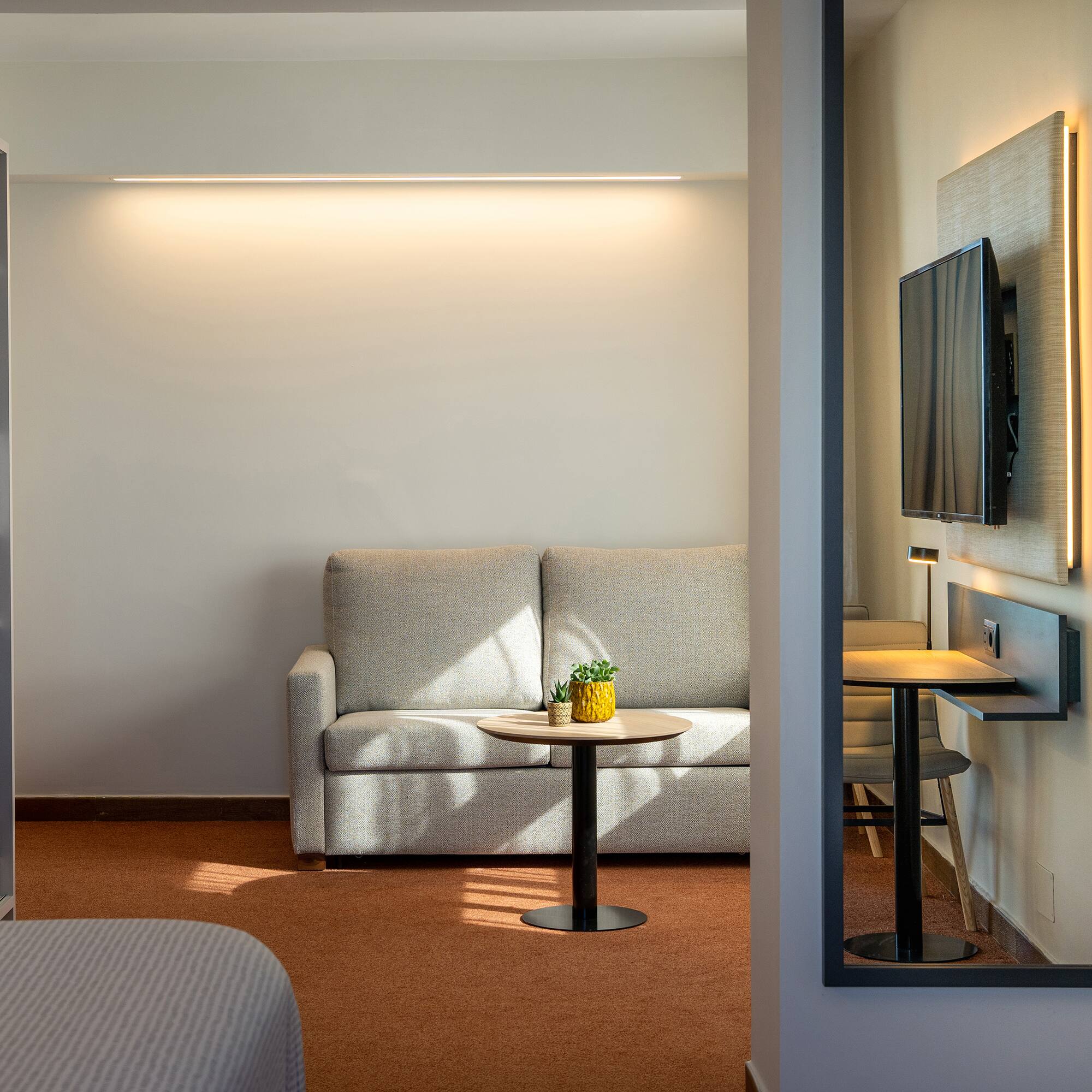 a room with a couch and tv