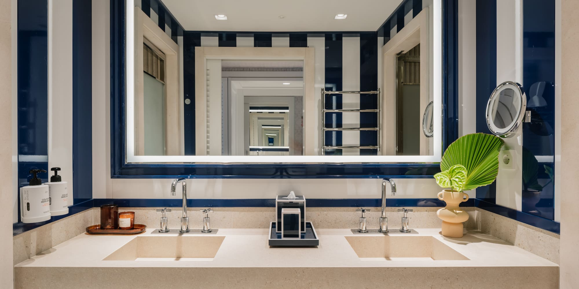 a bathroom with a mirror and sinks