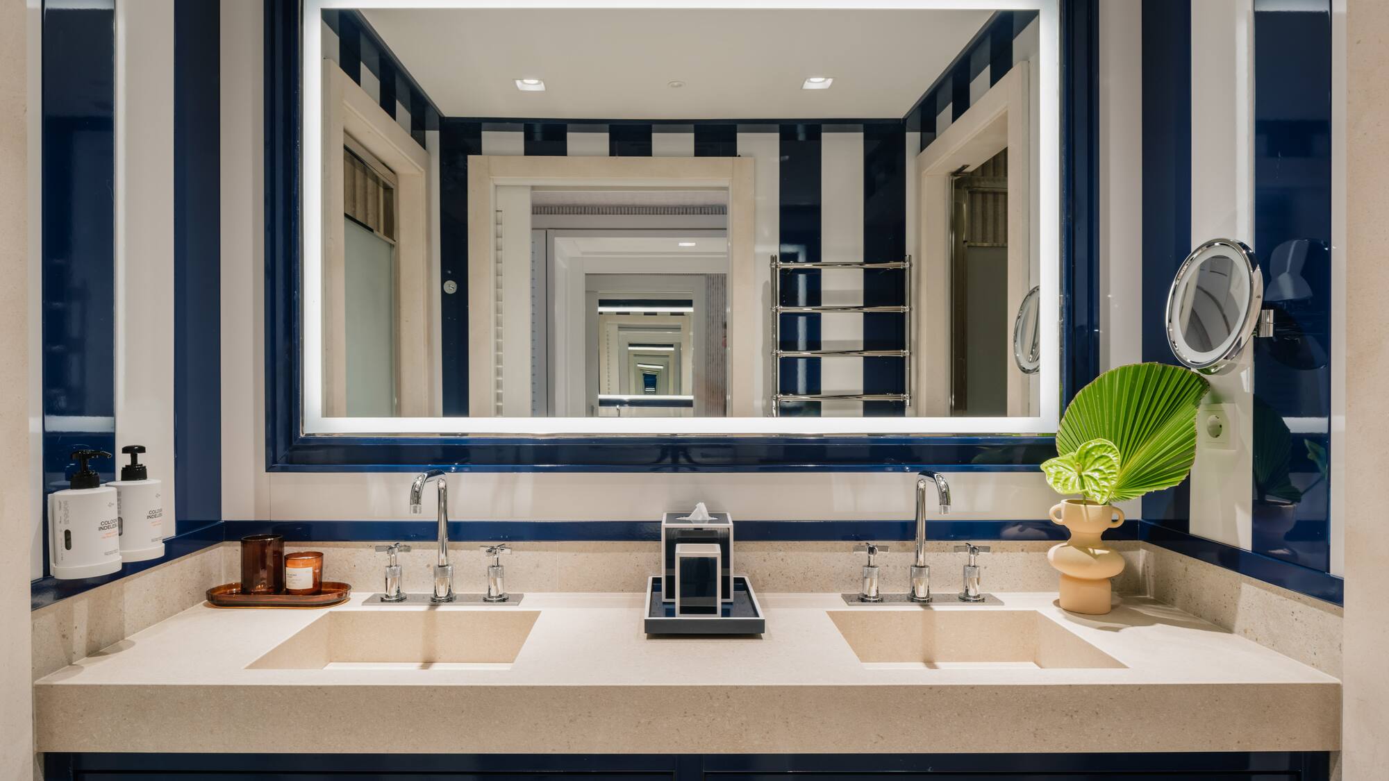 a bathroom with a mirror and sinks