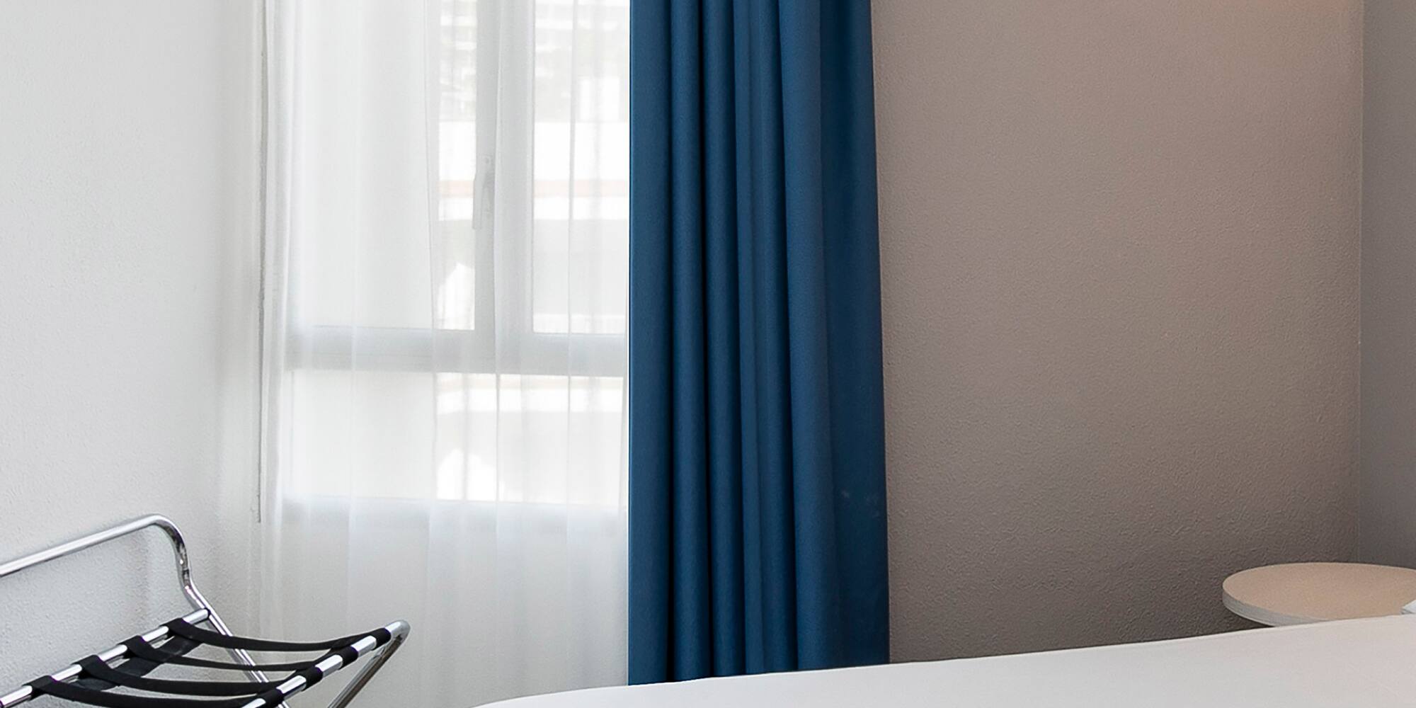 a room with a bed and a chair