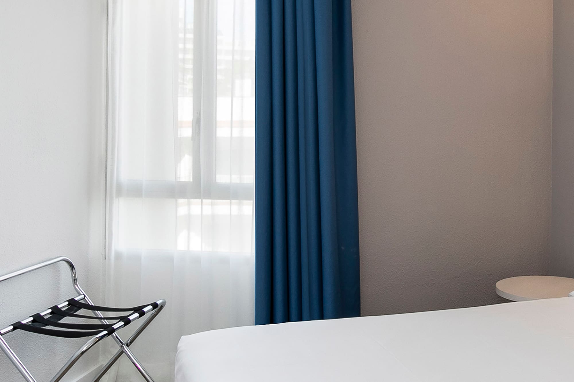 a room with a bed and a chair