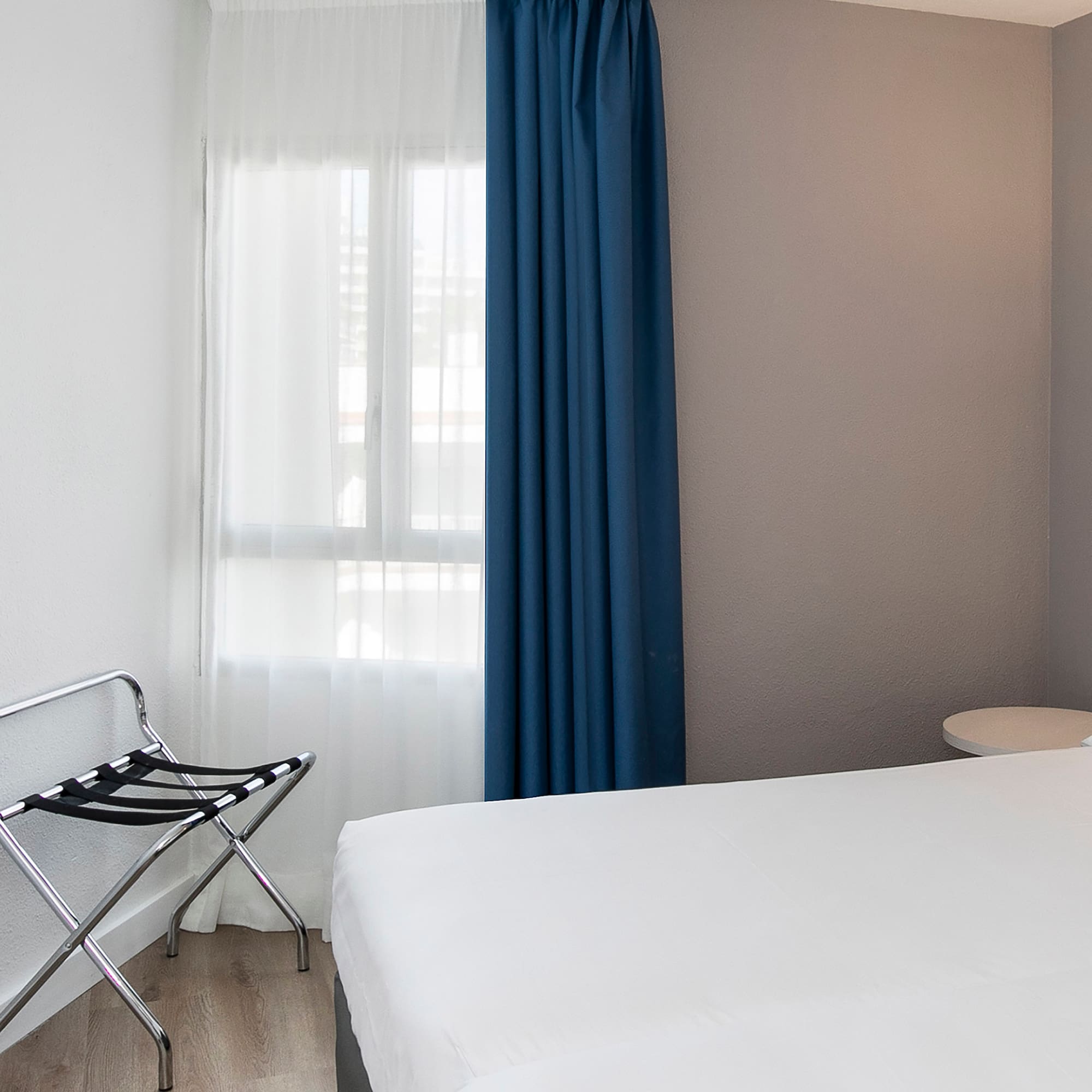 a room with a bed and a chair