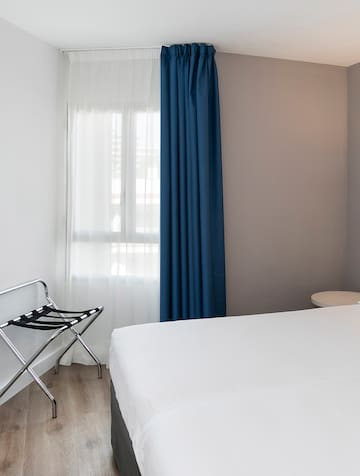 a room with a bed and a chair