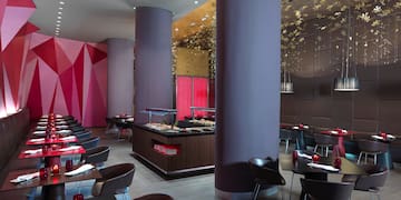 a restaurant with tables and chairs