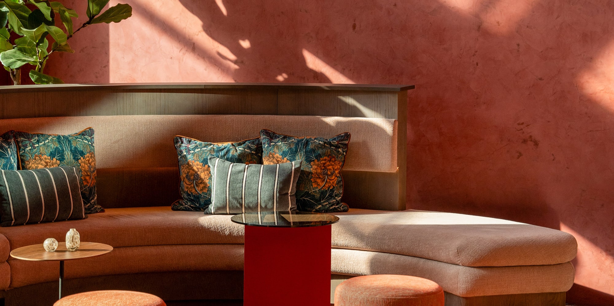 a couch with pillows in a room