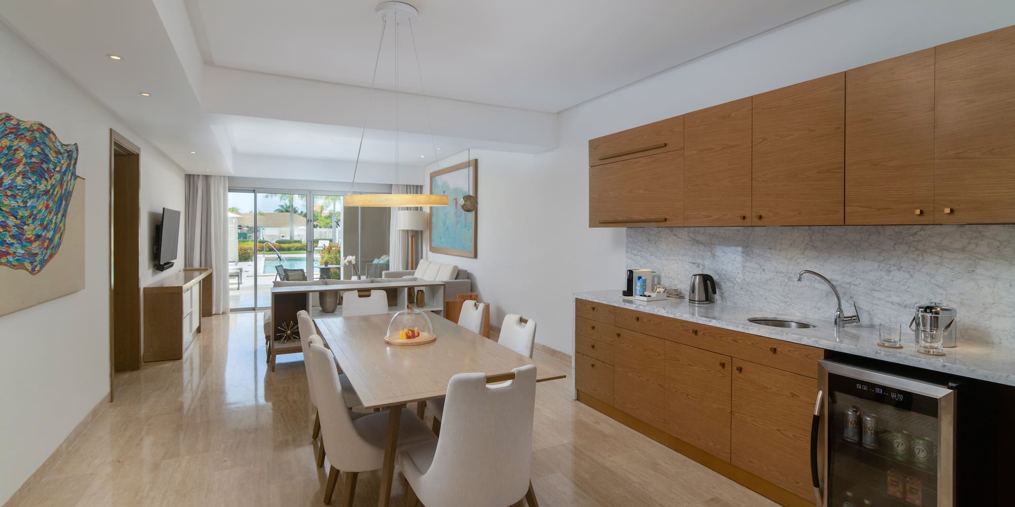 a kitchen and dining room with a table and chairs