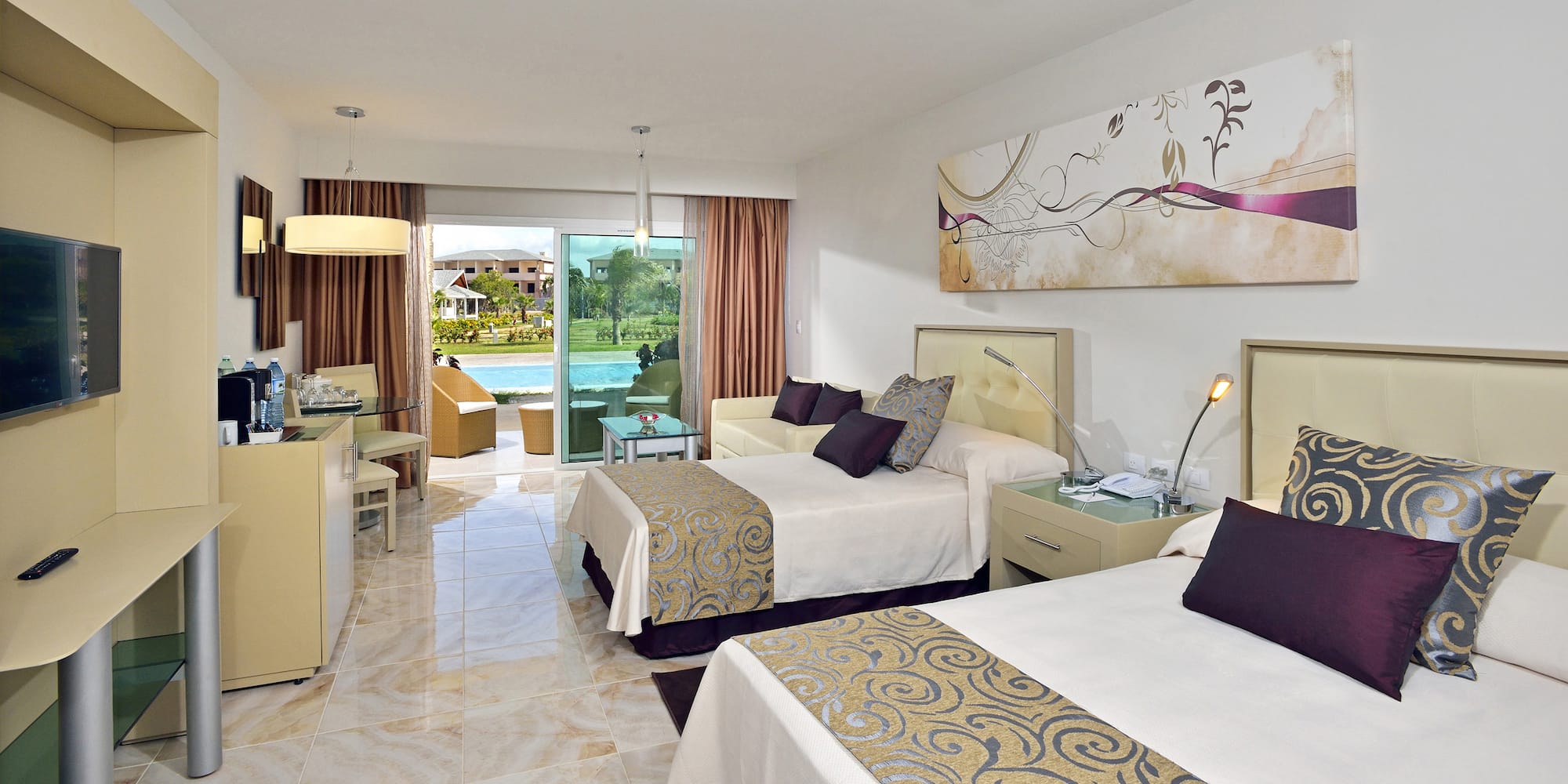 a room with two beds and a pool in the background