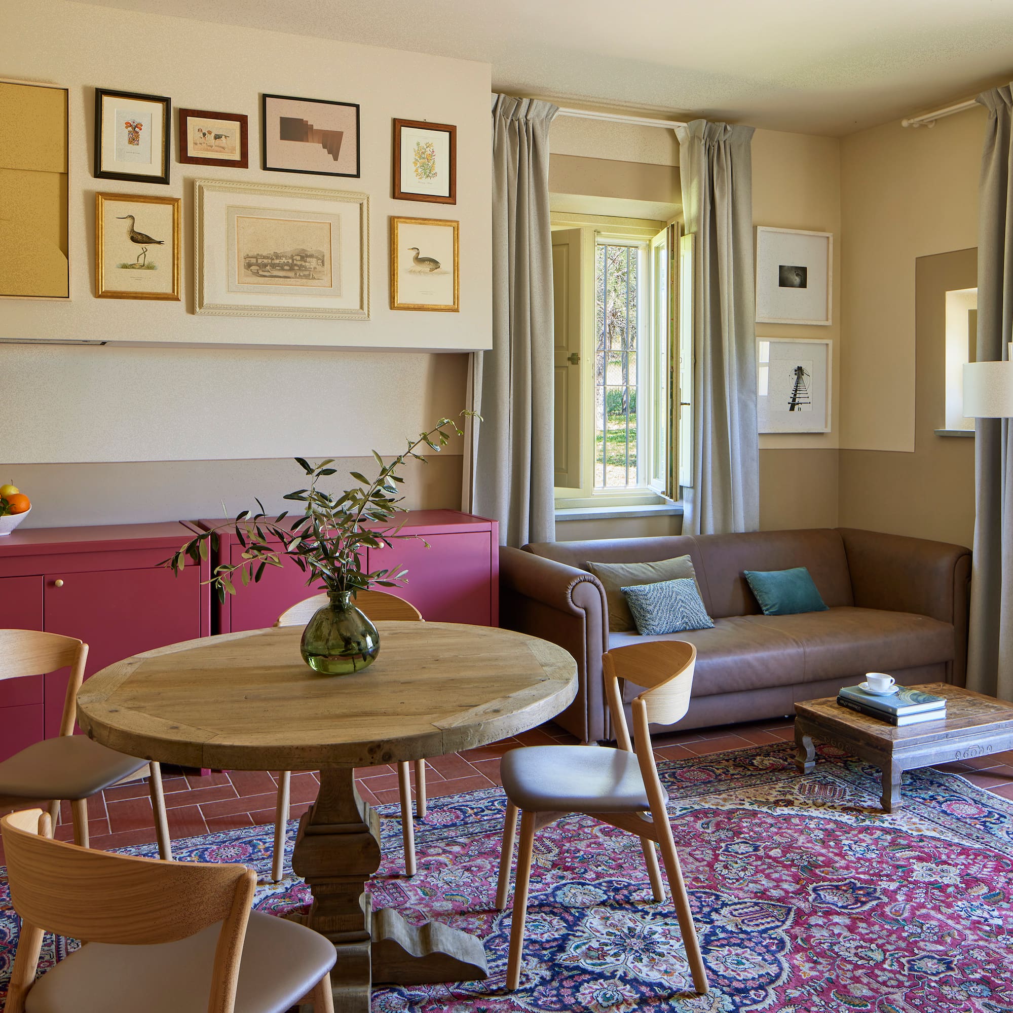a living room with a table and chairs
