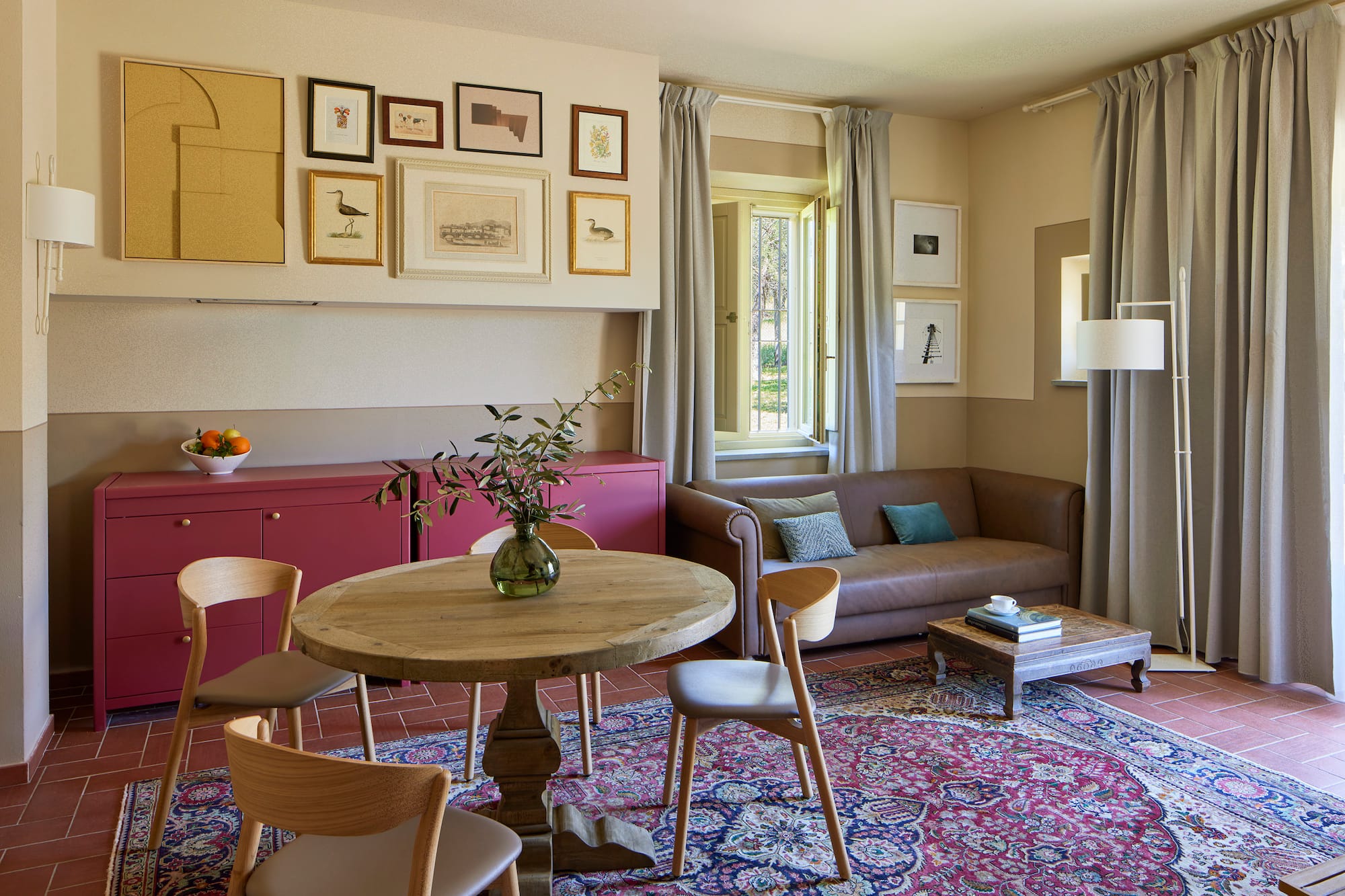 a living room with a table and chairs