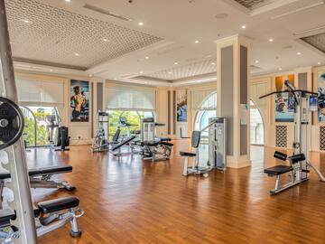 a large room with exercise equipment
