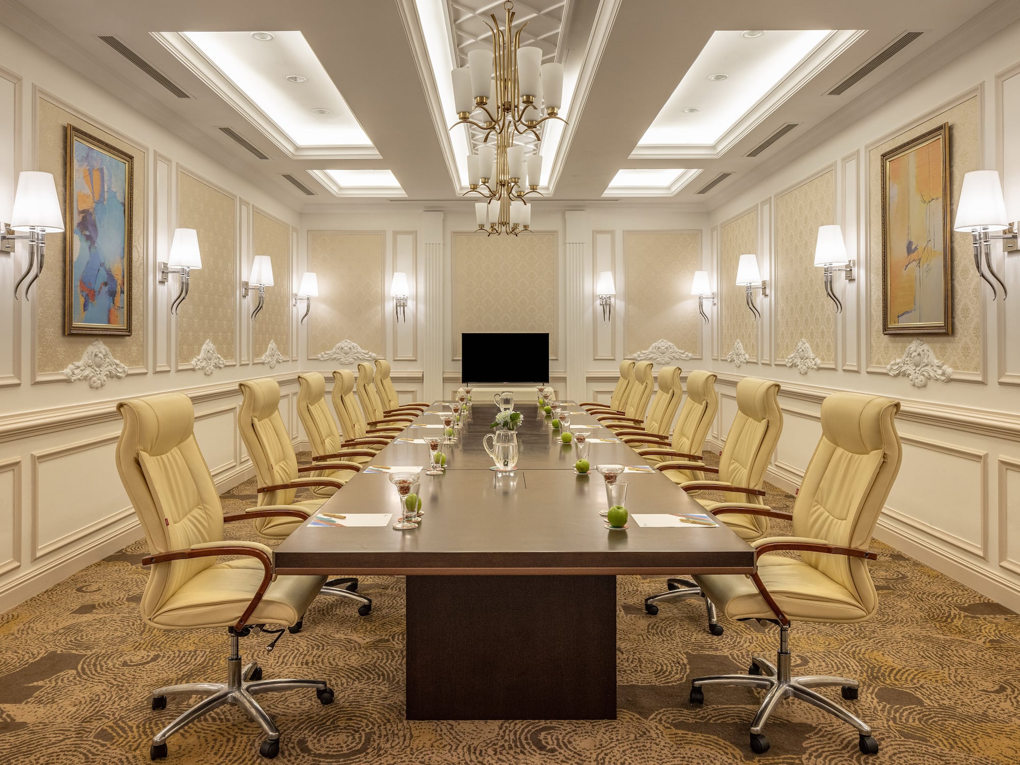 a conference room with a table and chairs
