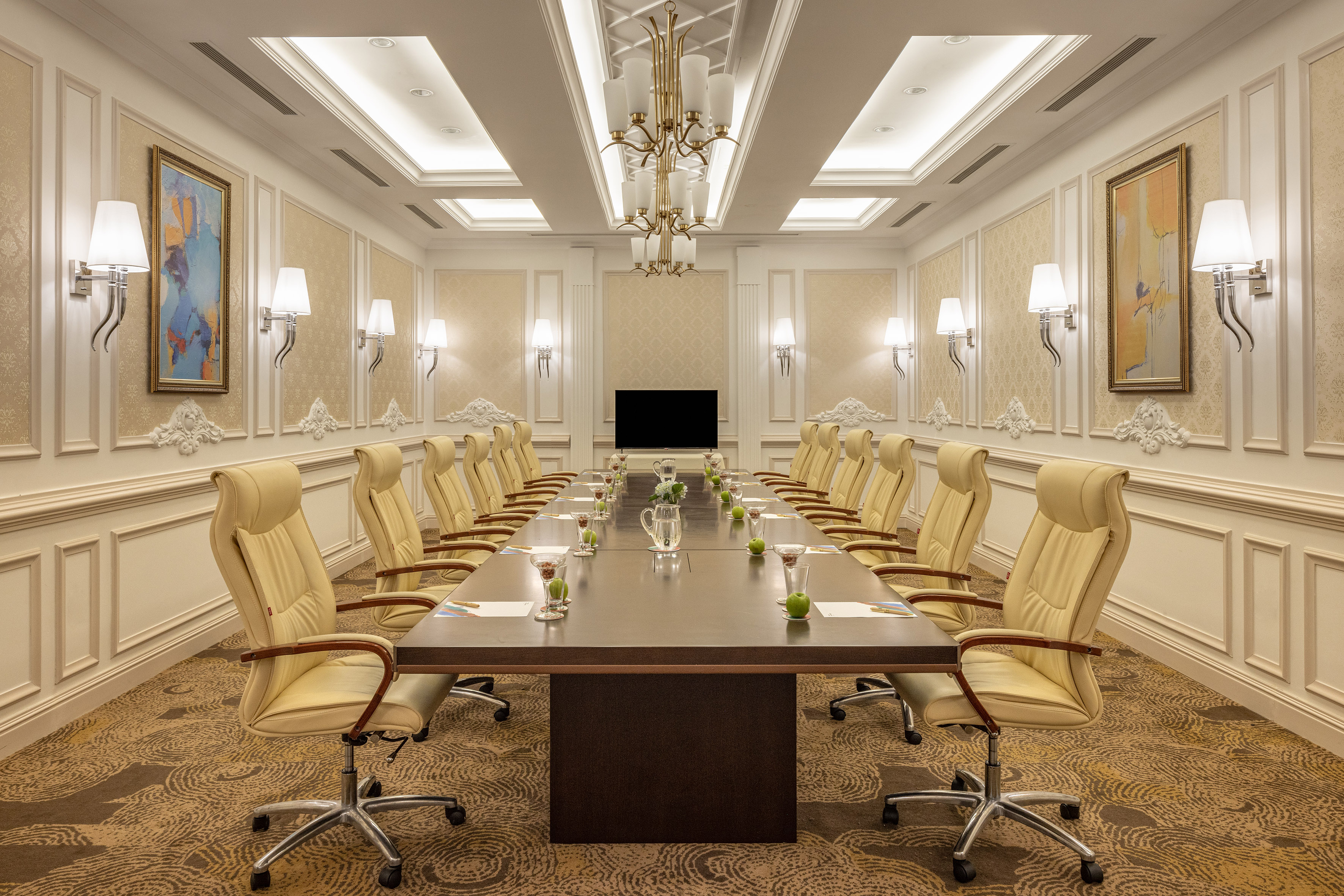 Luxury boardroom with long conference table, cream executive chairs, and chandelier. - Meeting Room 2 - Meliá Vinpearl Tay Ninh, Tay Ninh