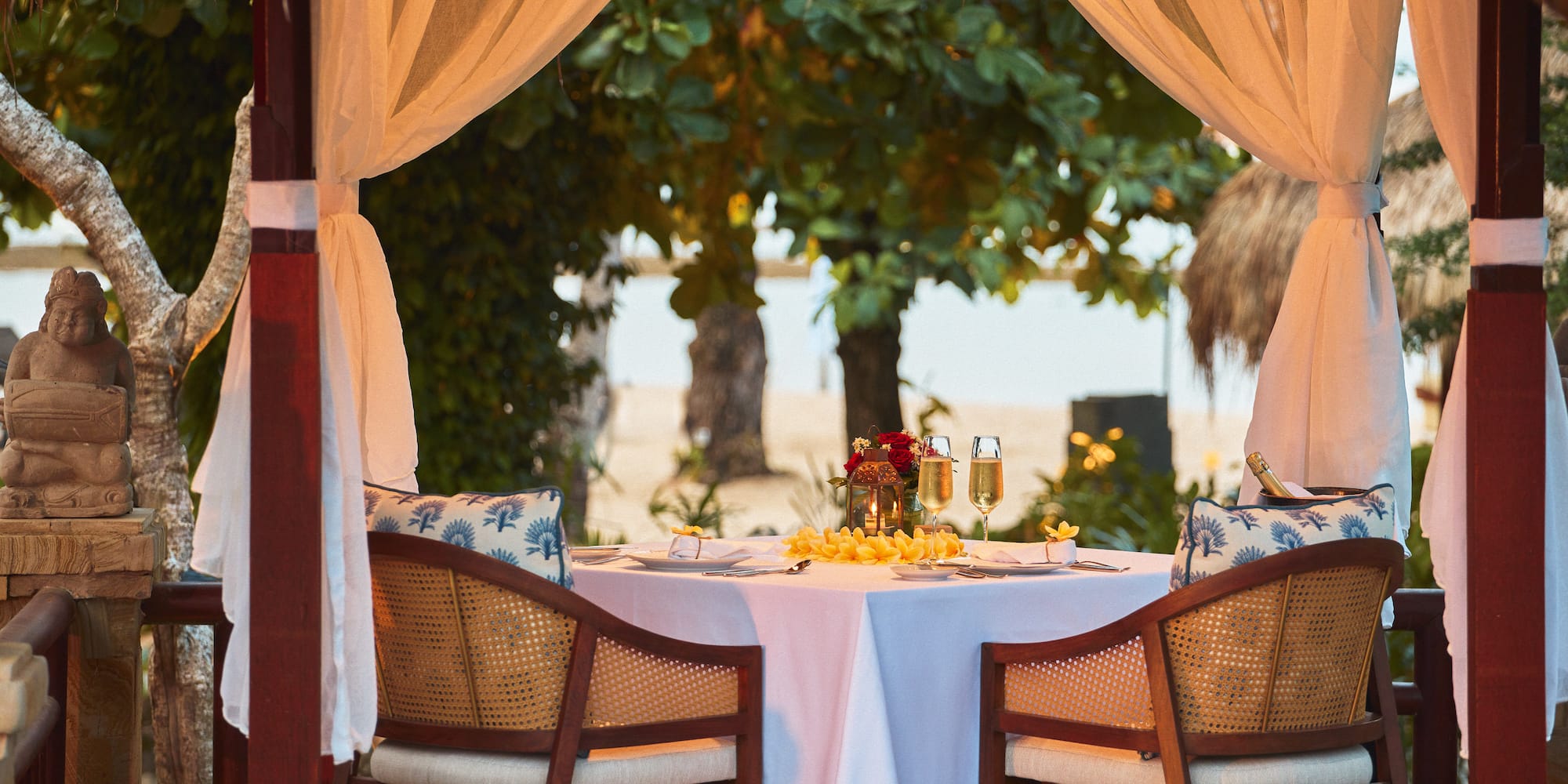 a table with a couple of chairs and a table with a couple of glasses on it