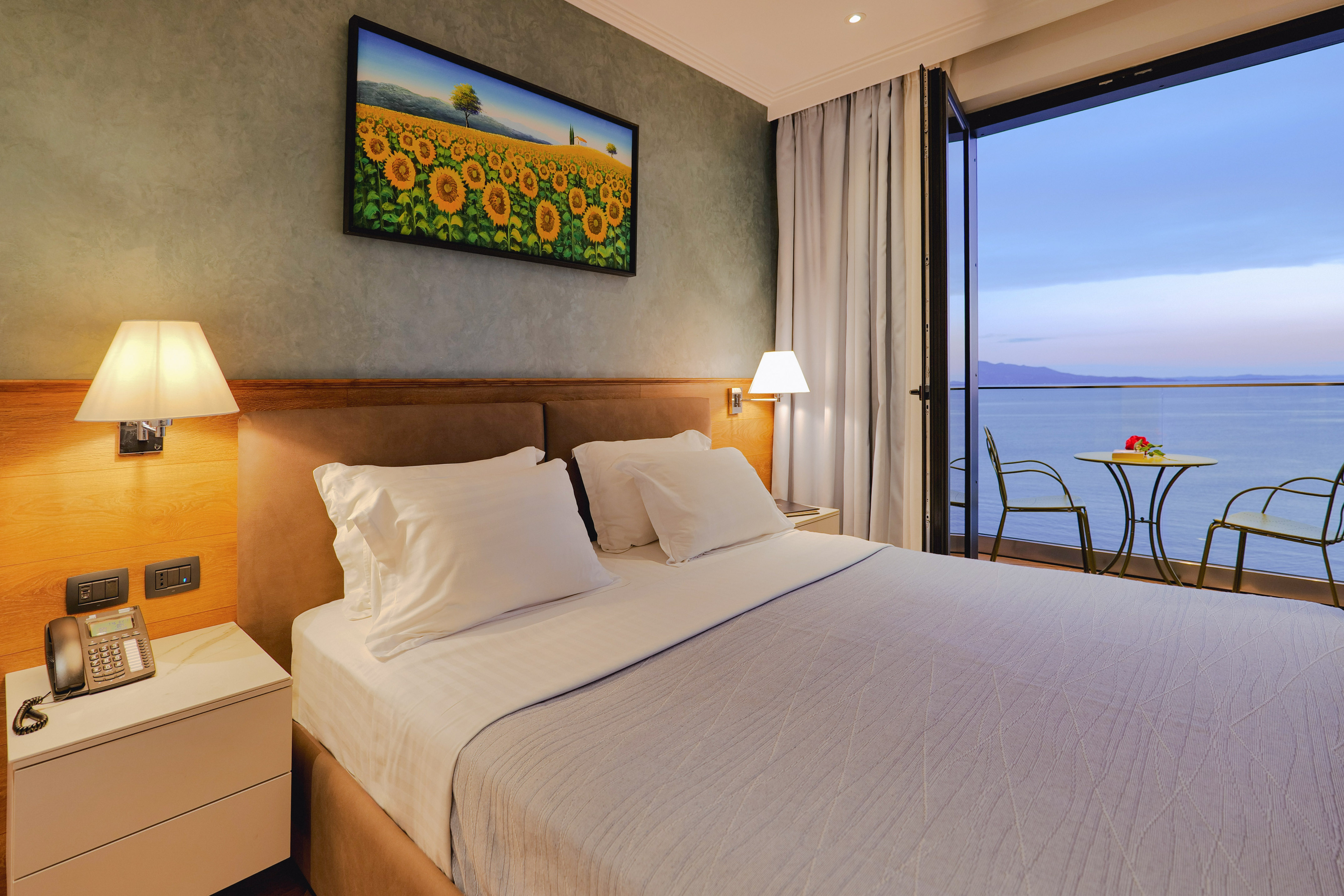 a bed with a view of the ocean
