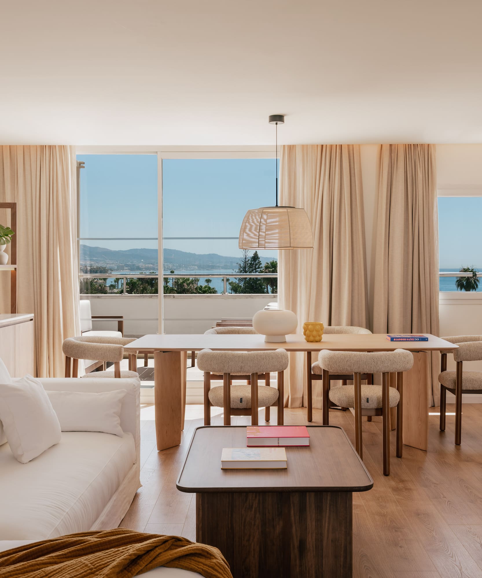 a living room with a table and chairs