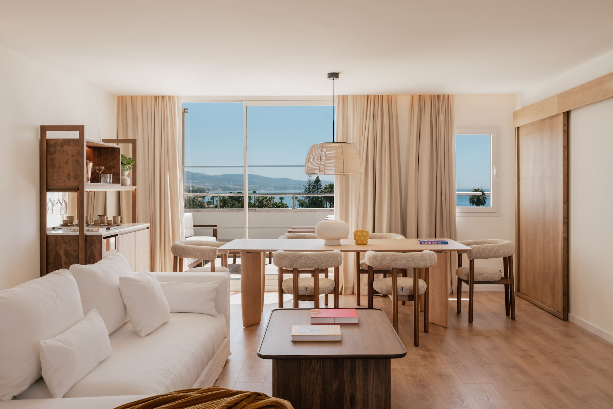 a living room with a table and chairs