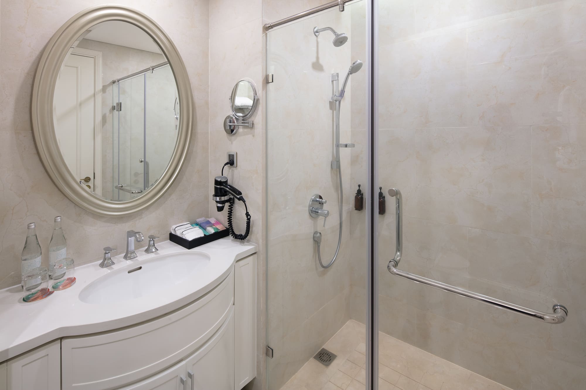 a bathroom with a shower and a sink