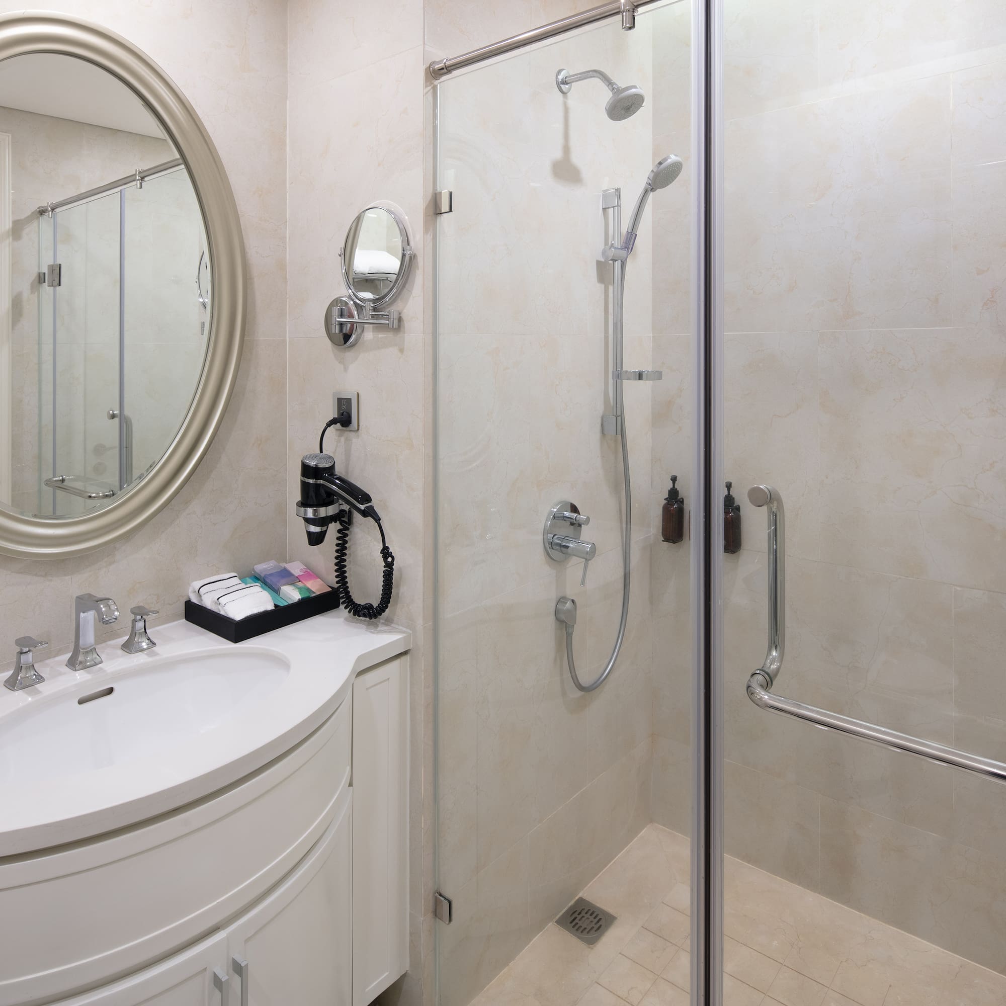 a bathroom with a shower and a sink