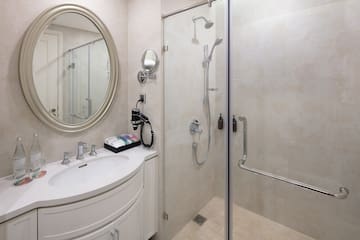 a bathroom with a shower and a sink