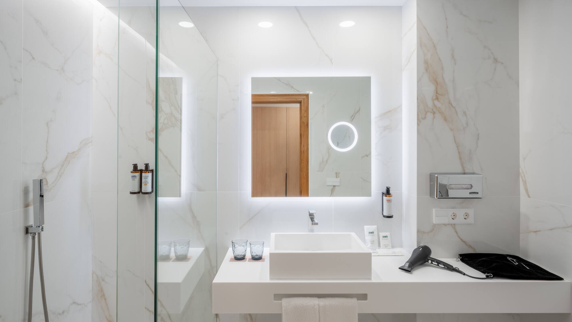 a bathroom with a mirror and a sink