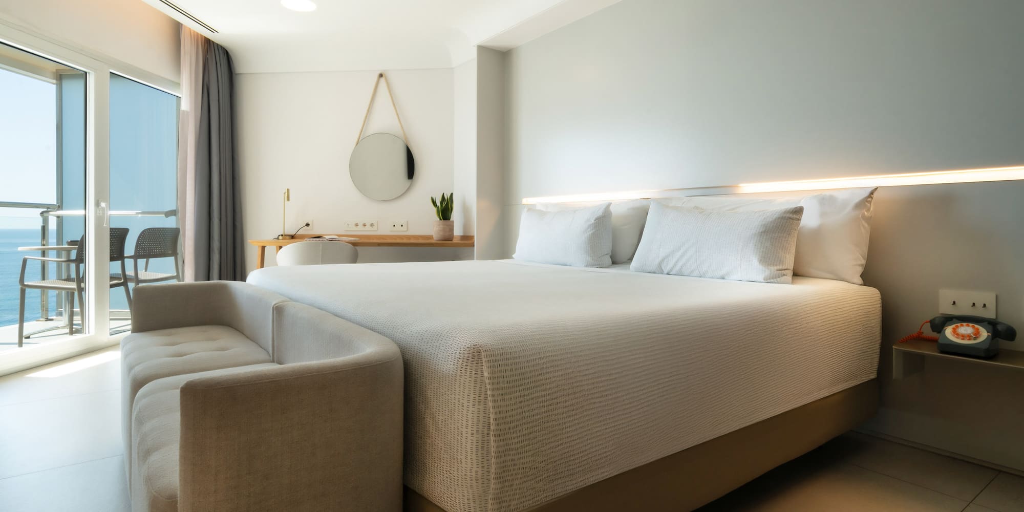 a bed with a couch in a room