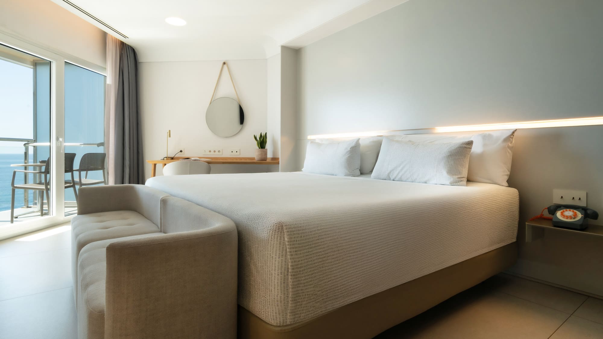 a bed with a couch in a room