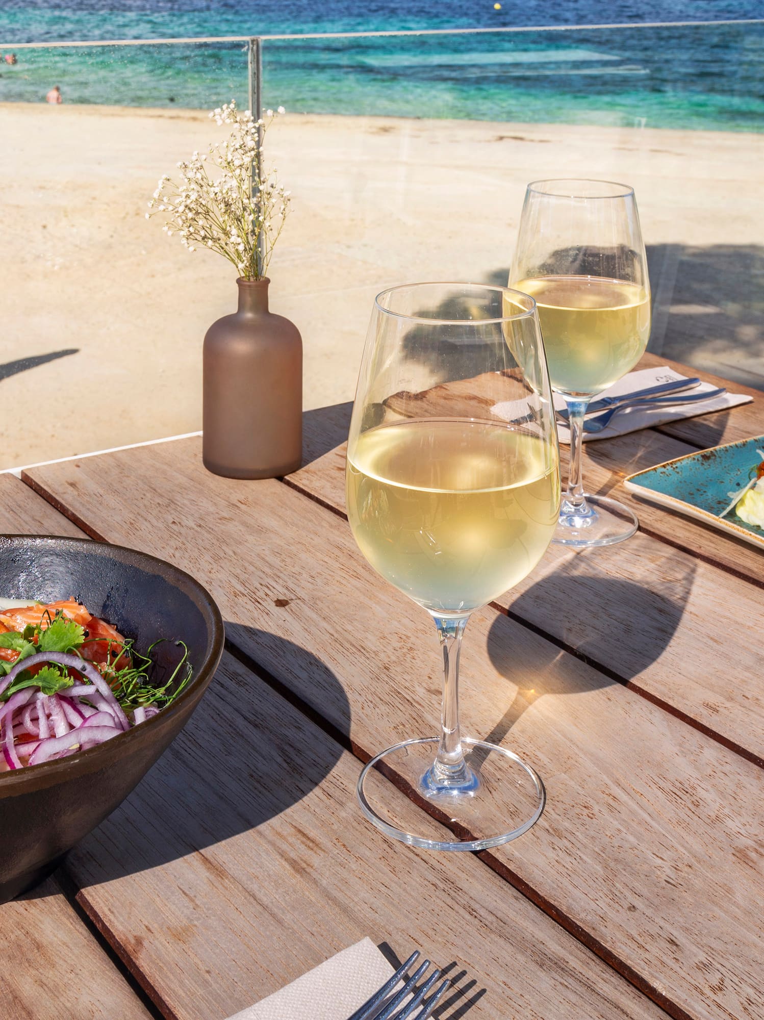 a table with food and wine glasses on it