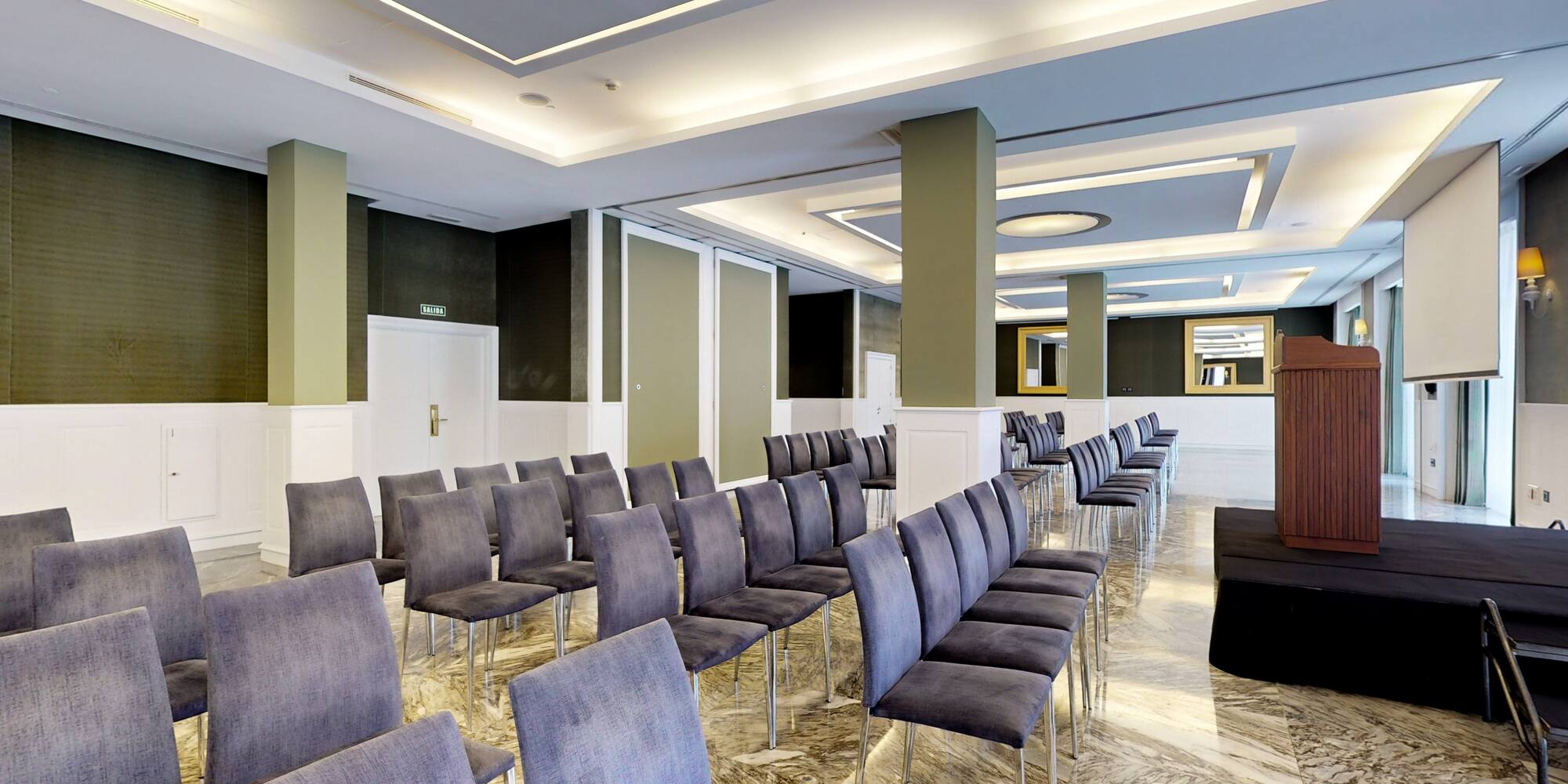 a room with chairs and a door