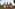 Brick Buddhist temple with multiple spires and intricate relief carvings.