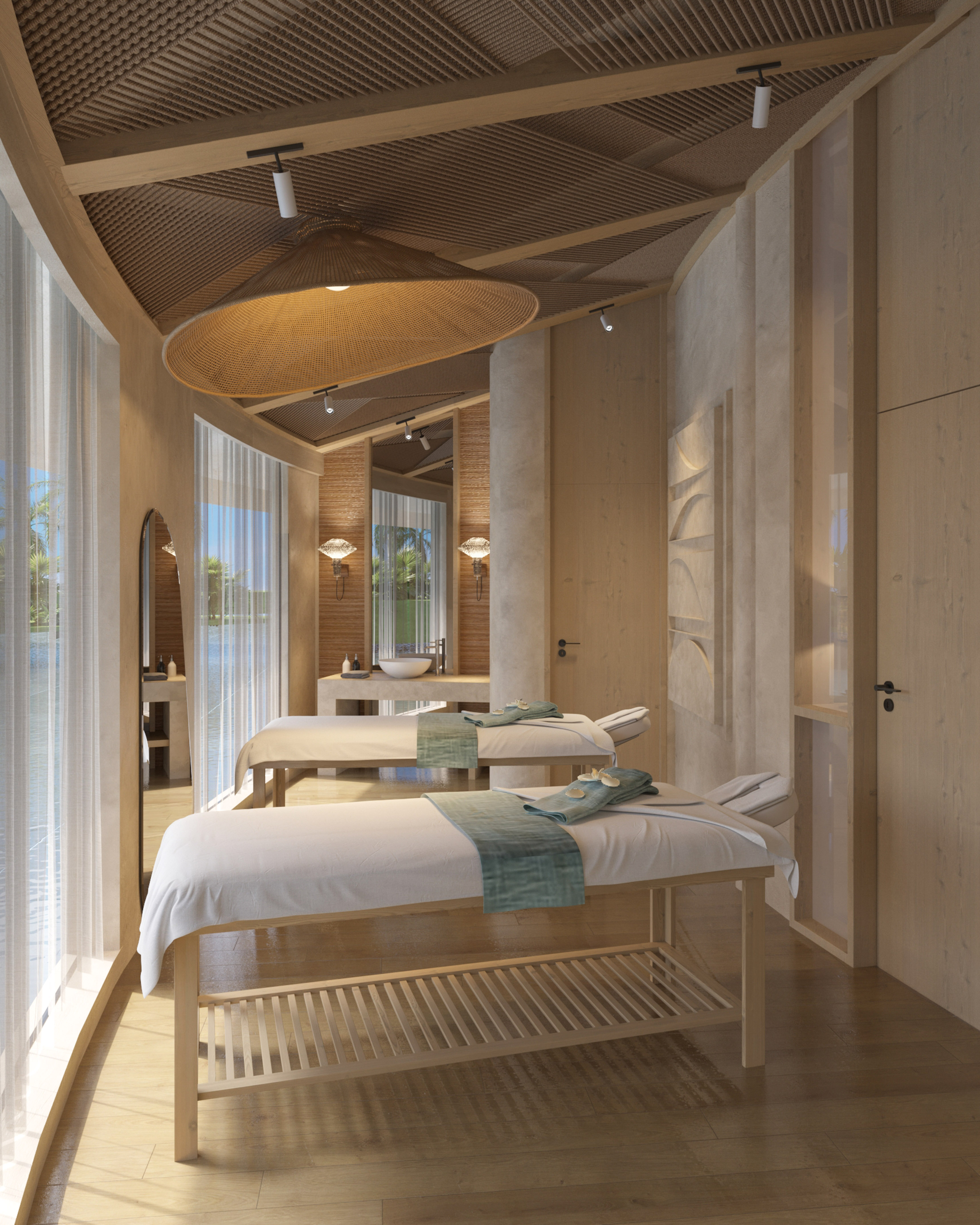Luxury spa massage room with two beds, wooden accents, and tropical water view.