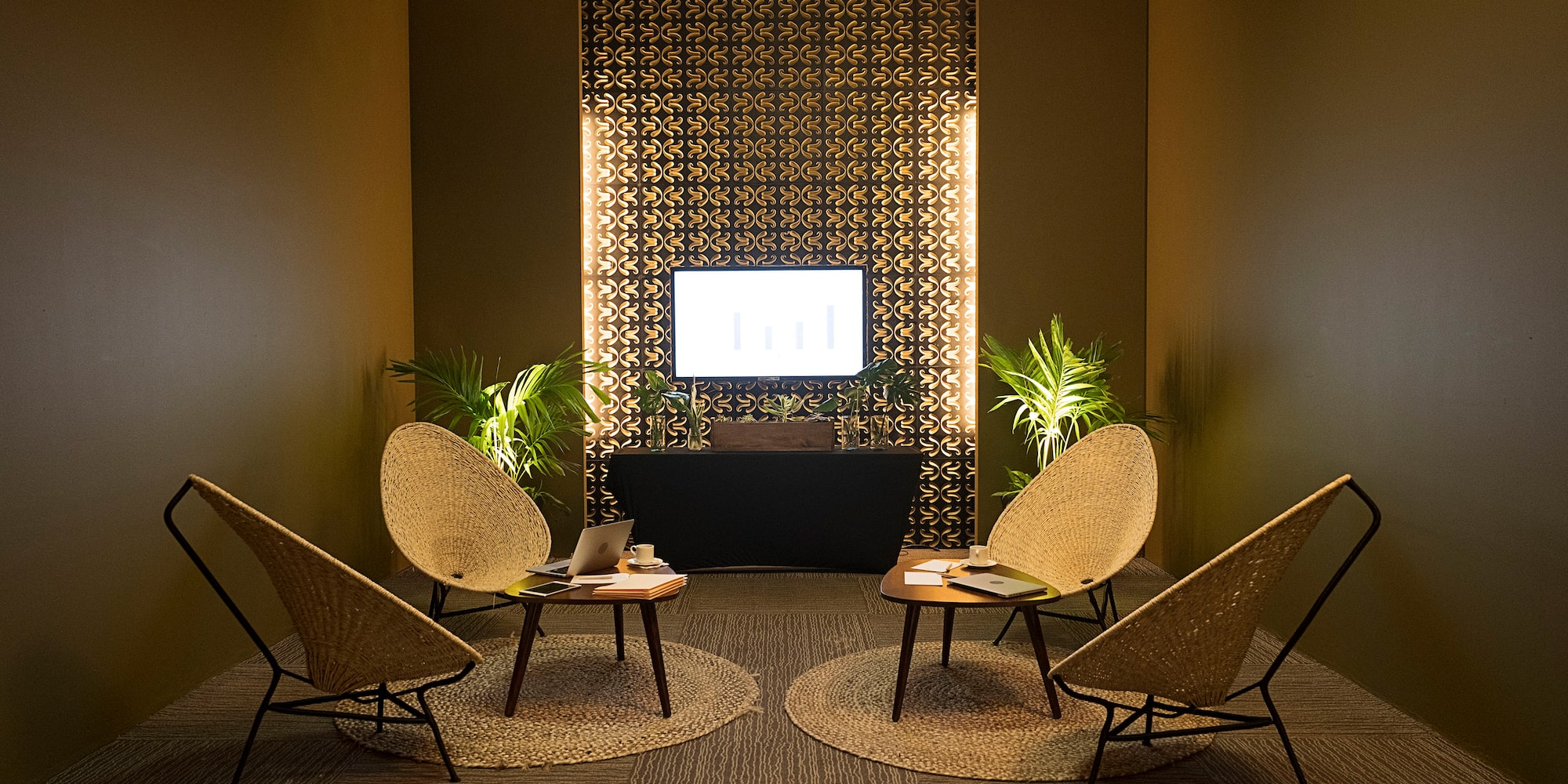 a room with chairs and a television