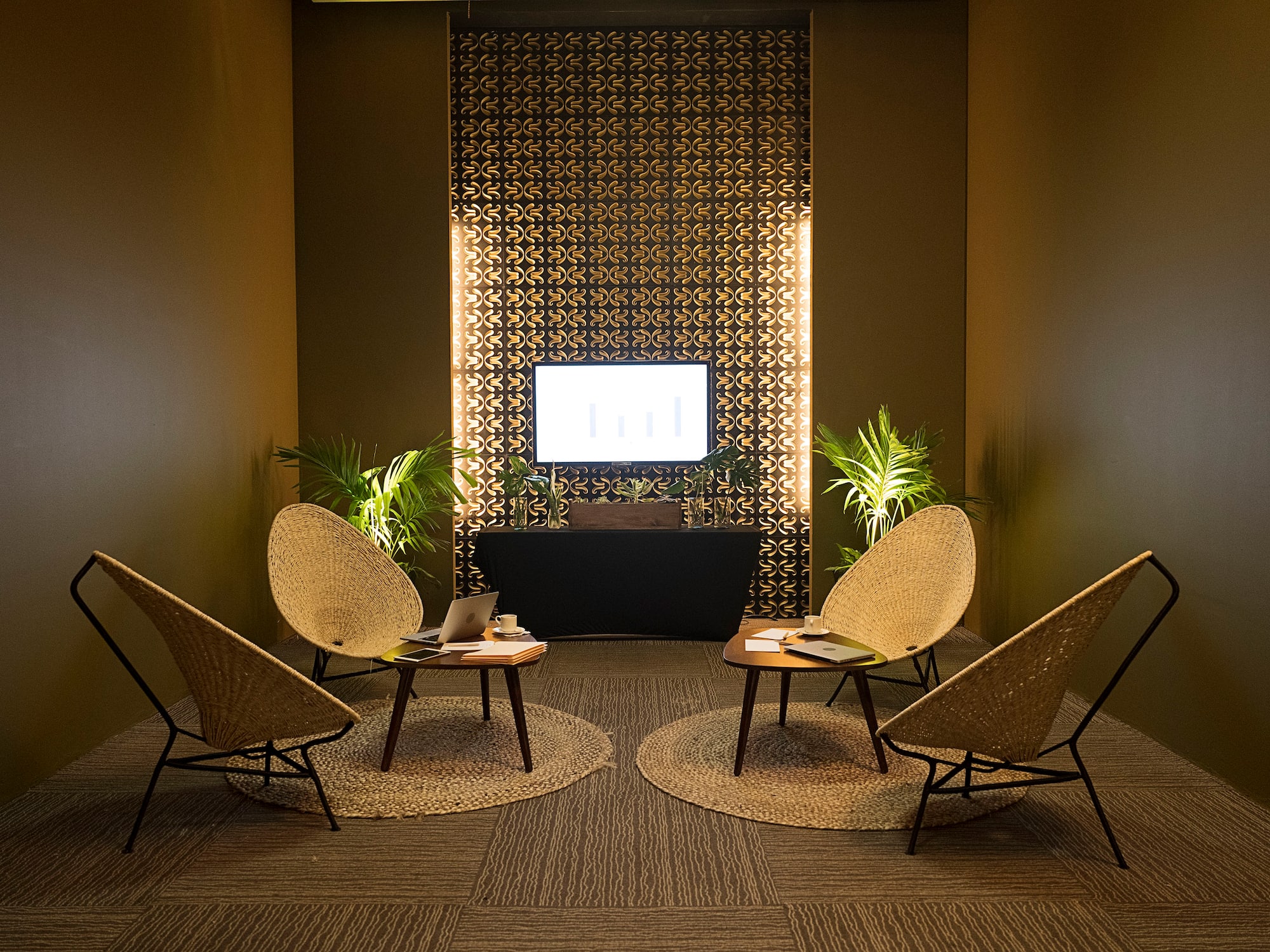 a room with chairs and a television