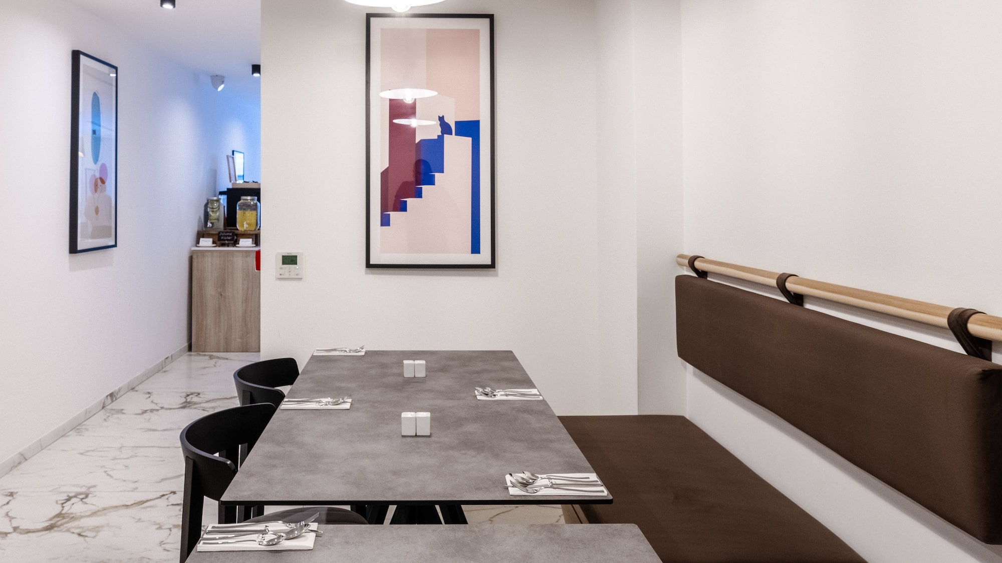 a table with brown seats and a white wall