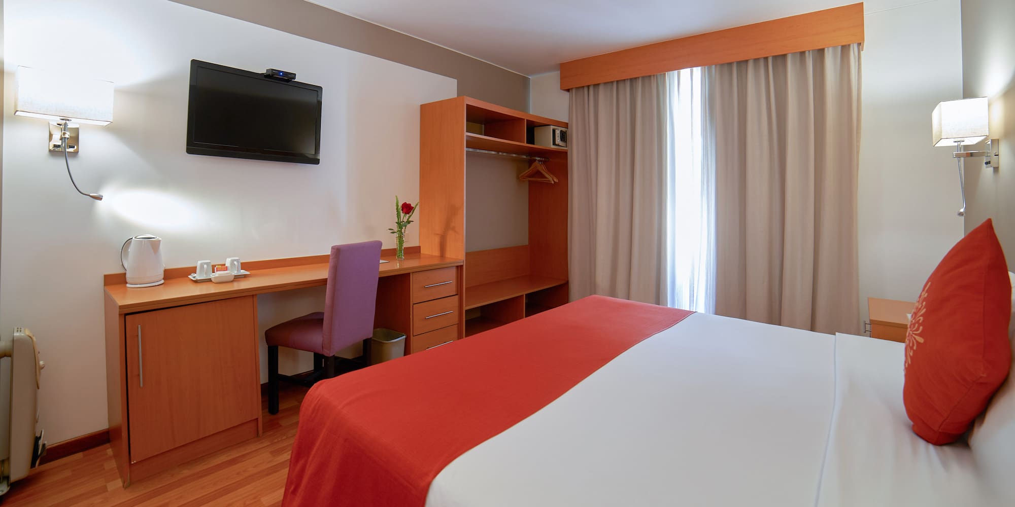 a room with a bed and a desk