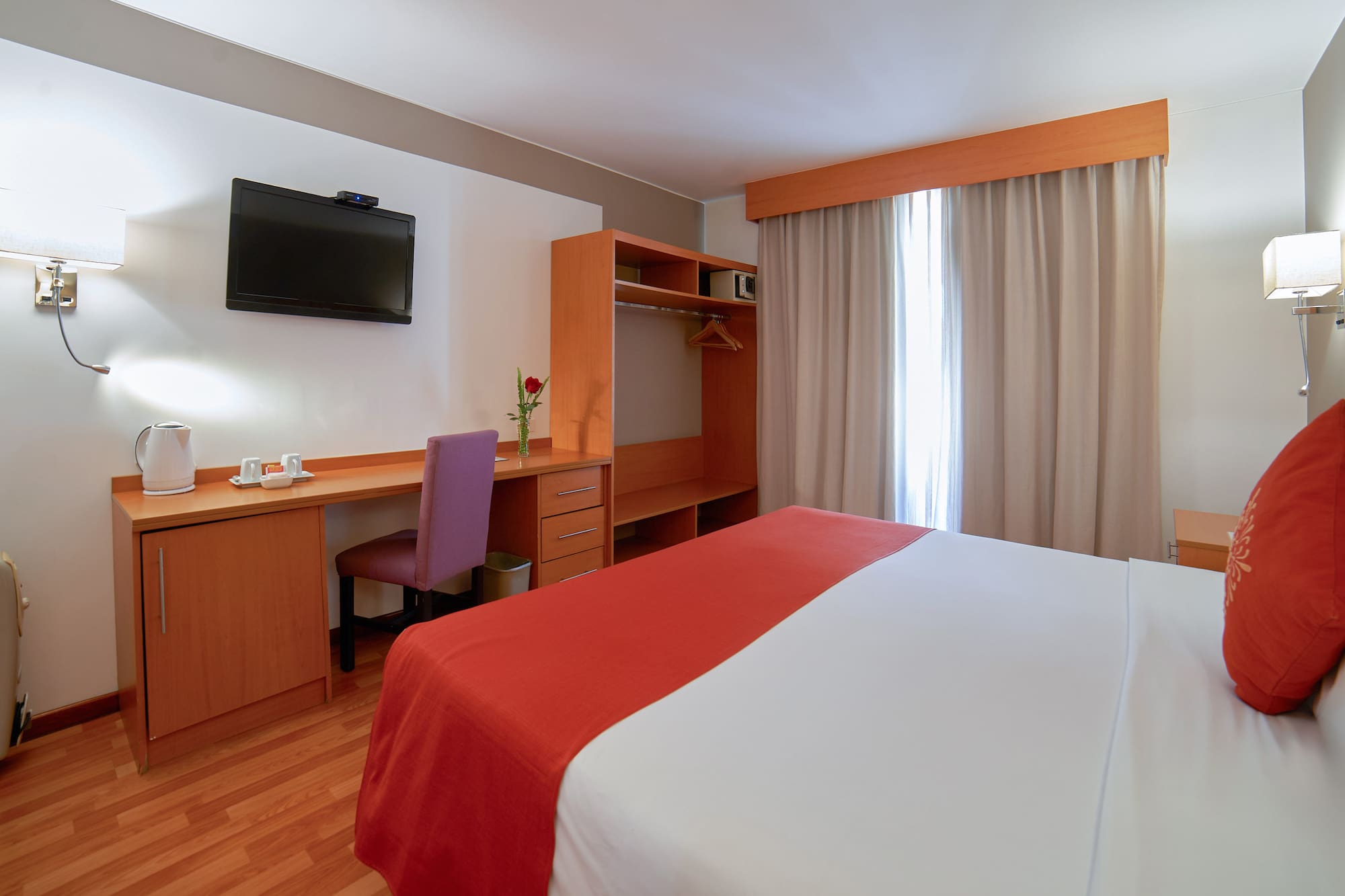 a room with a bed and a desk