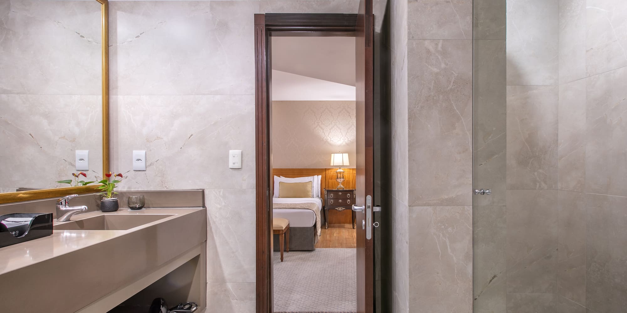 a bathroom with a mirror and sink