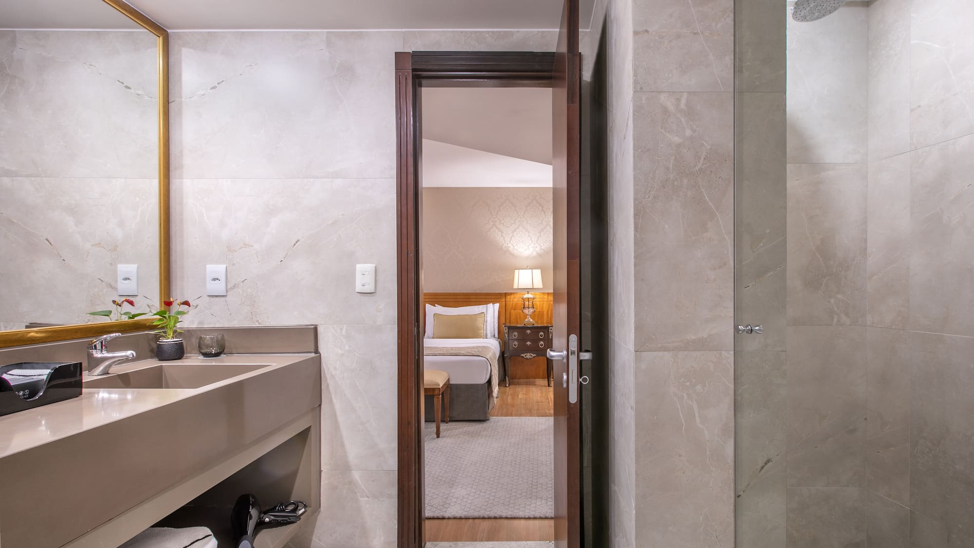 a bathroom with a mirror and sink