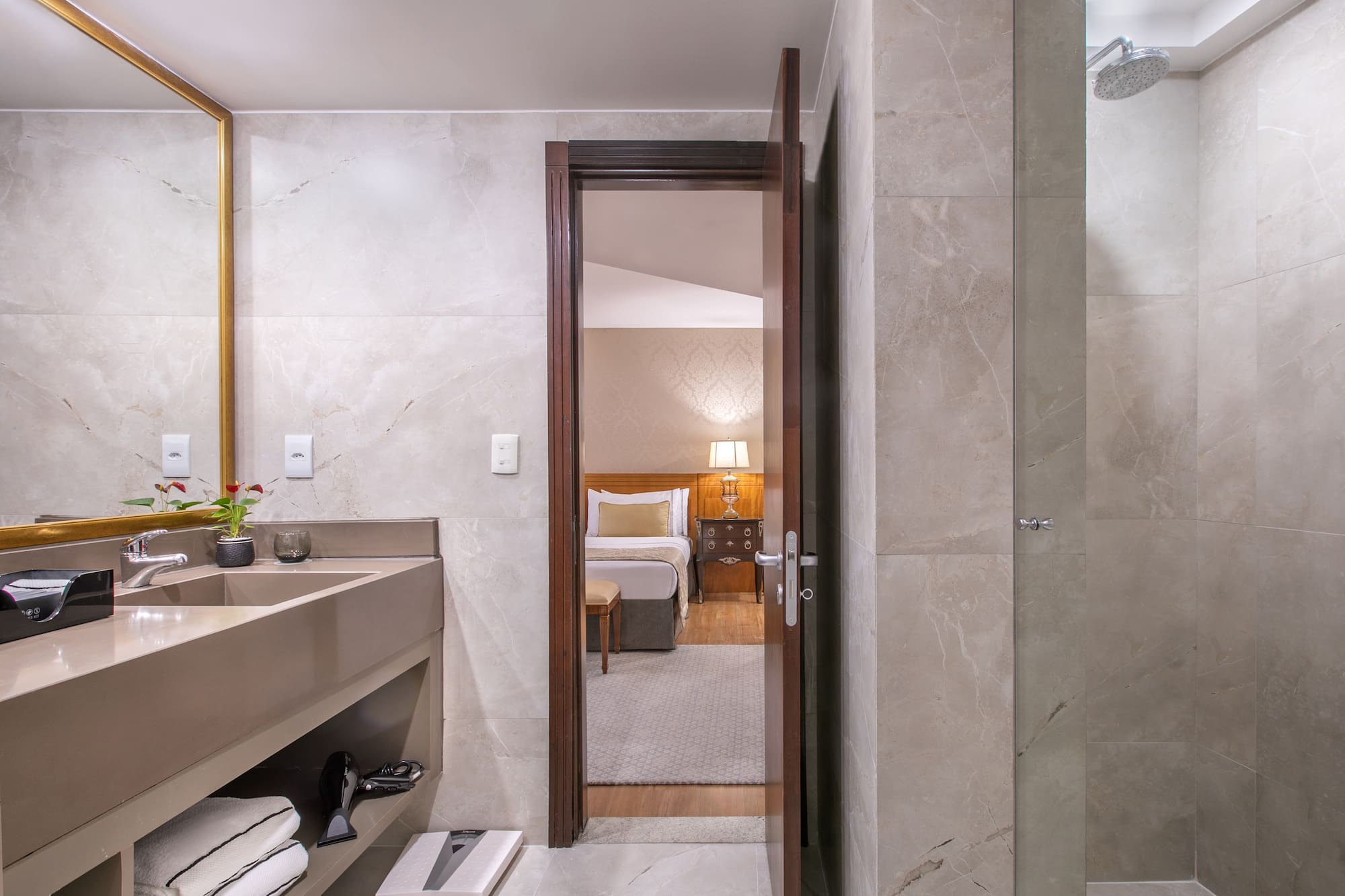 a bathroom with a mirror and sink