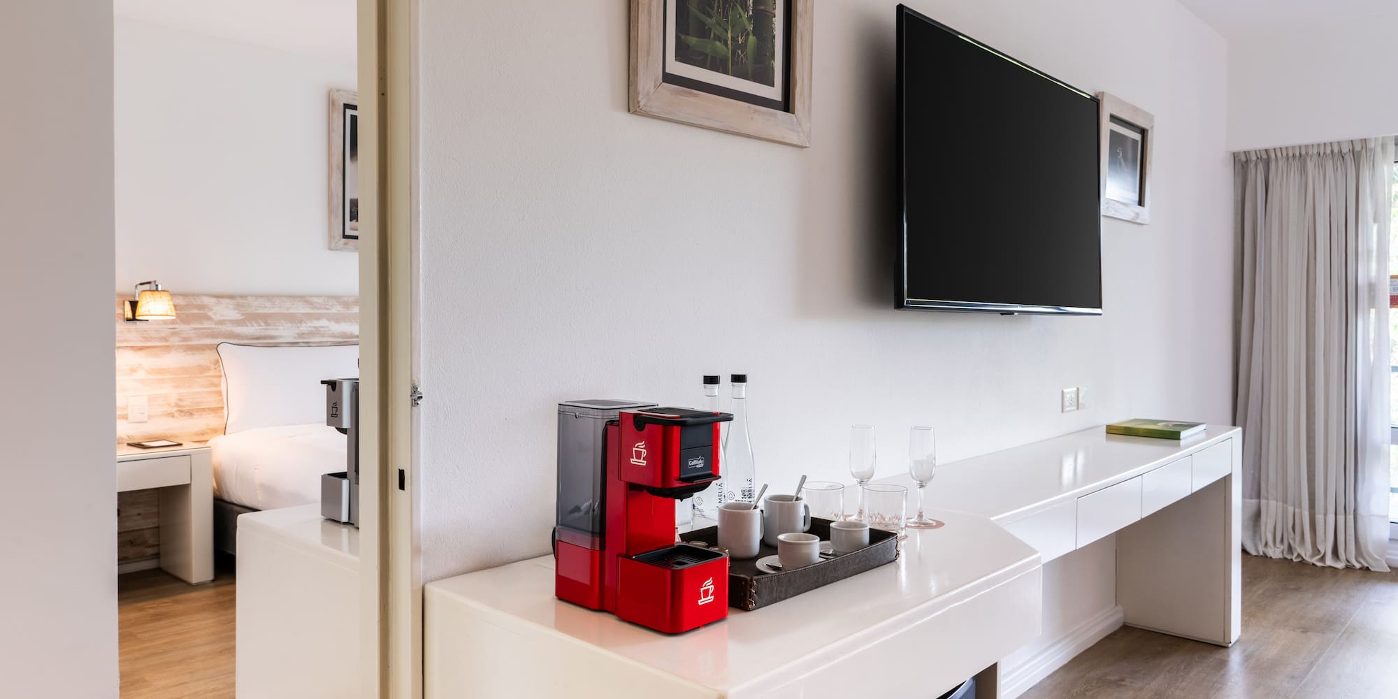 a room with a tv and a coffee maker