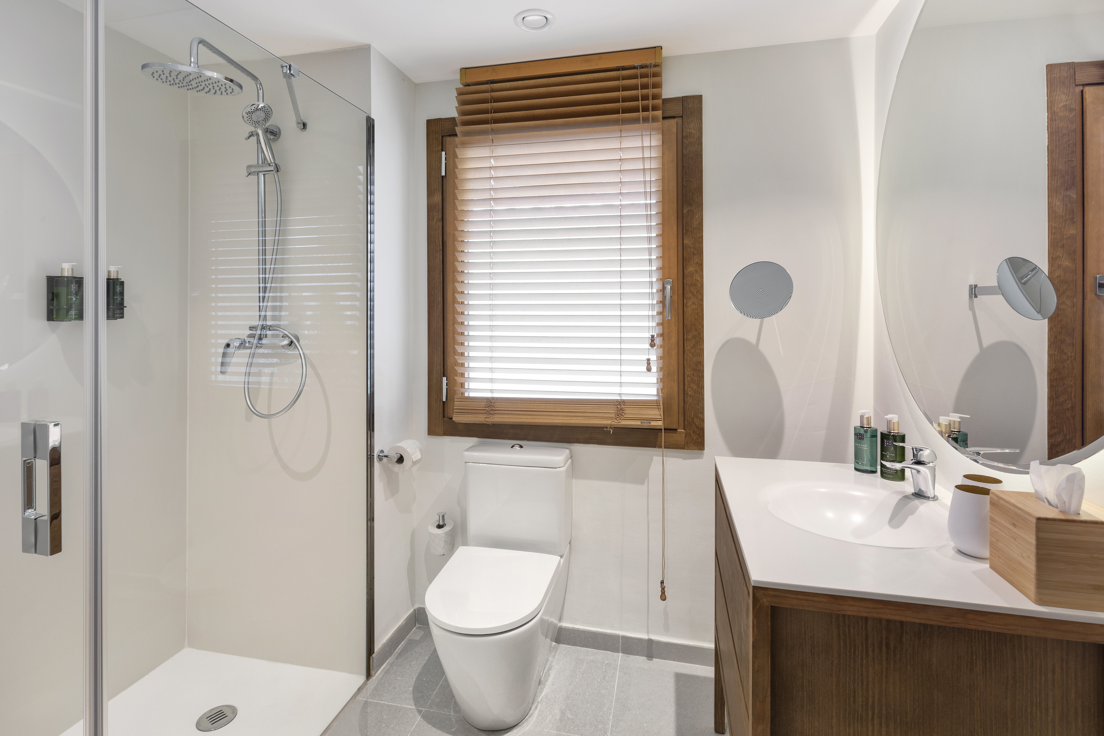 a bathroom with a shower and toilet